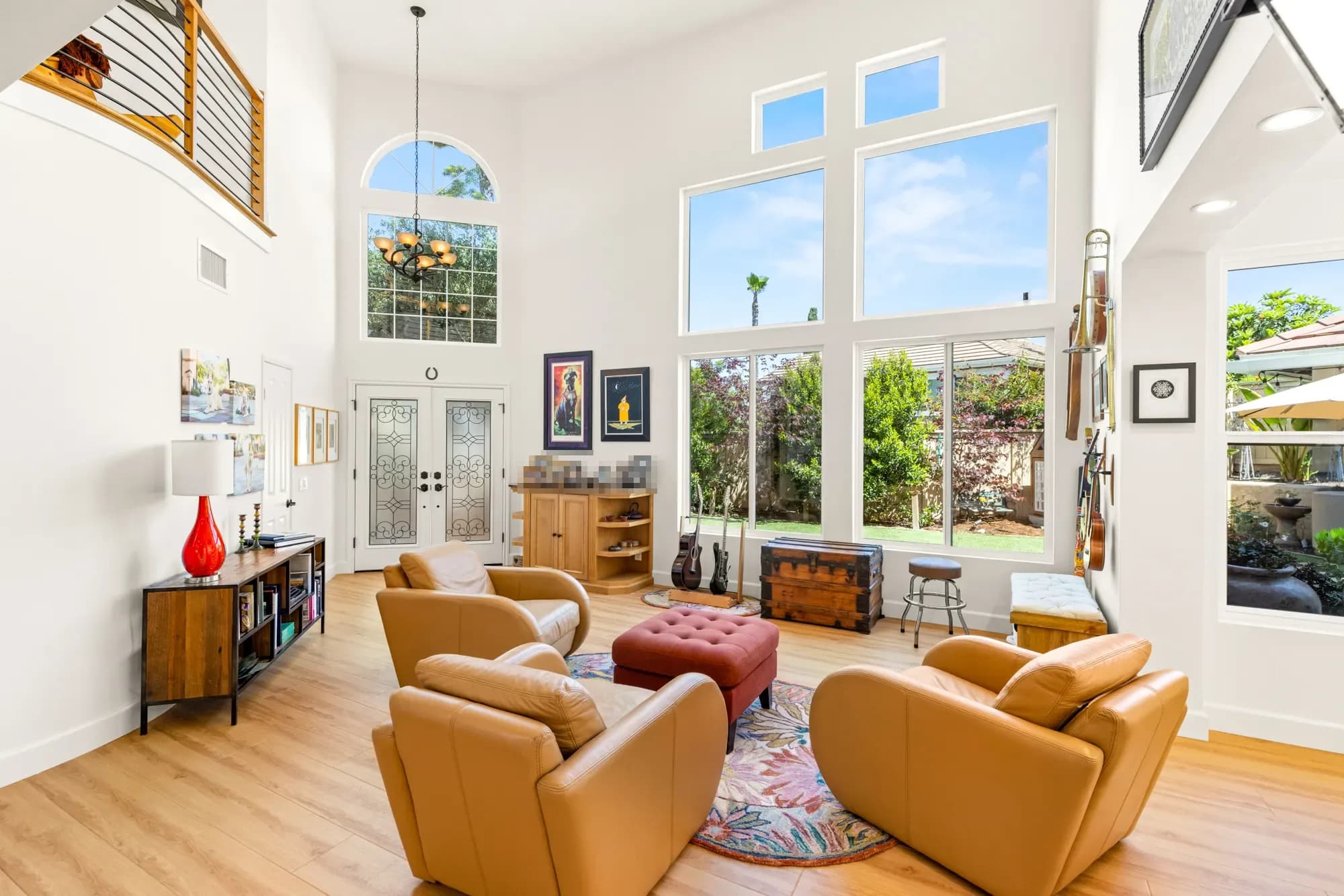 Two-story great room with tall windows after a Teknik whole-house renovation in Tierrasanta