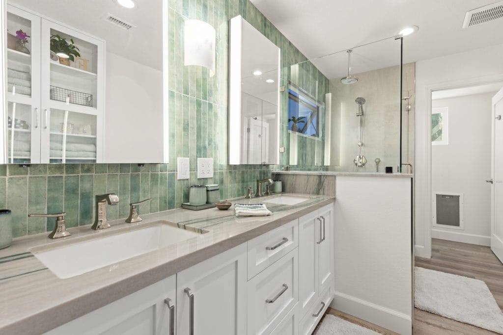 Modern bathroom remodeling with double vanity and glass shower by Teknik