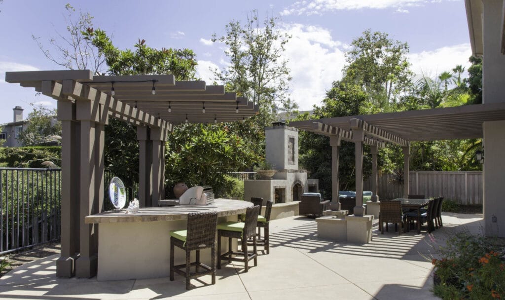 Outdoor living space and whole home renovation with a pergola and BBQ in San Diego