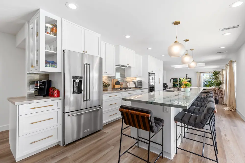 san diego kitchen remodel with white cabinets marble island and pendant lighting